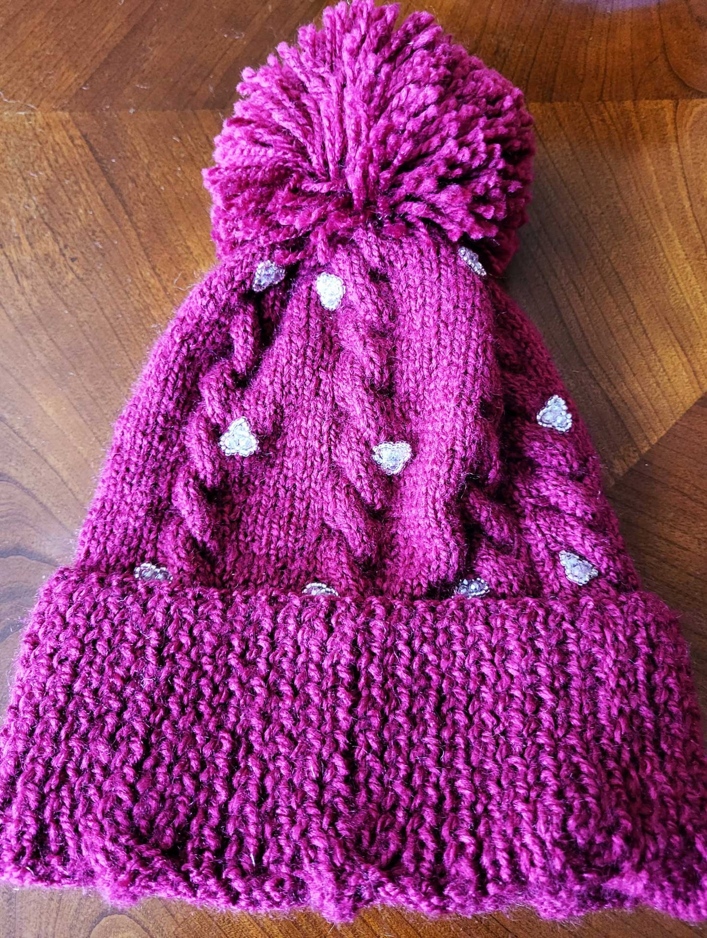 Pom pom embellished hats