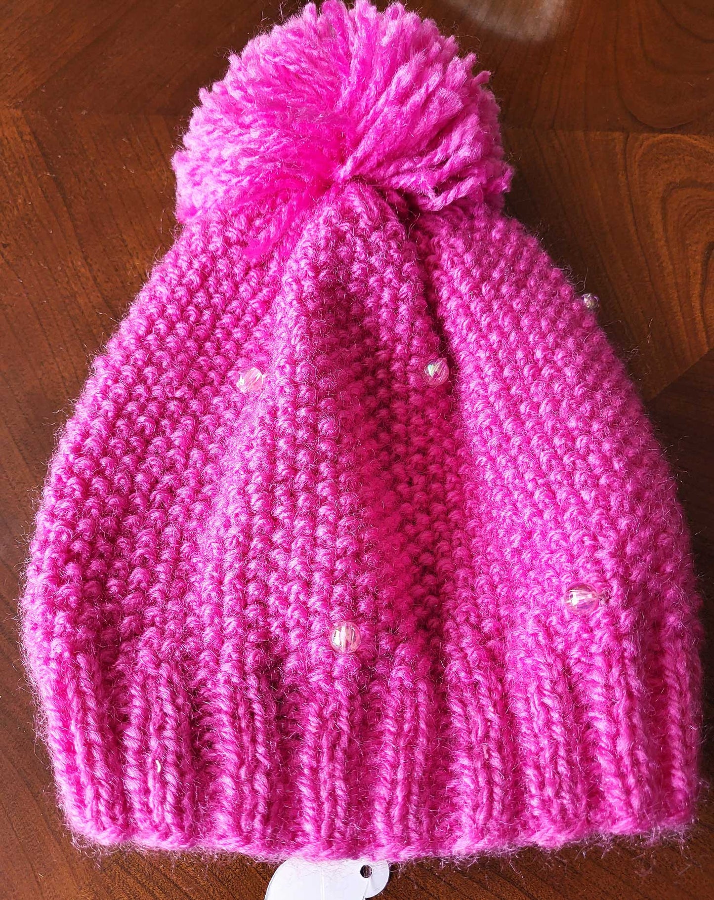 Pom pom embellished hats