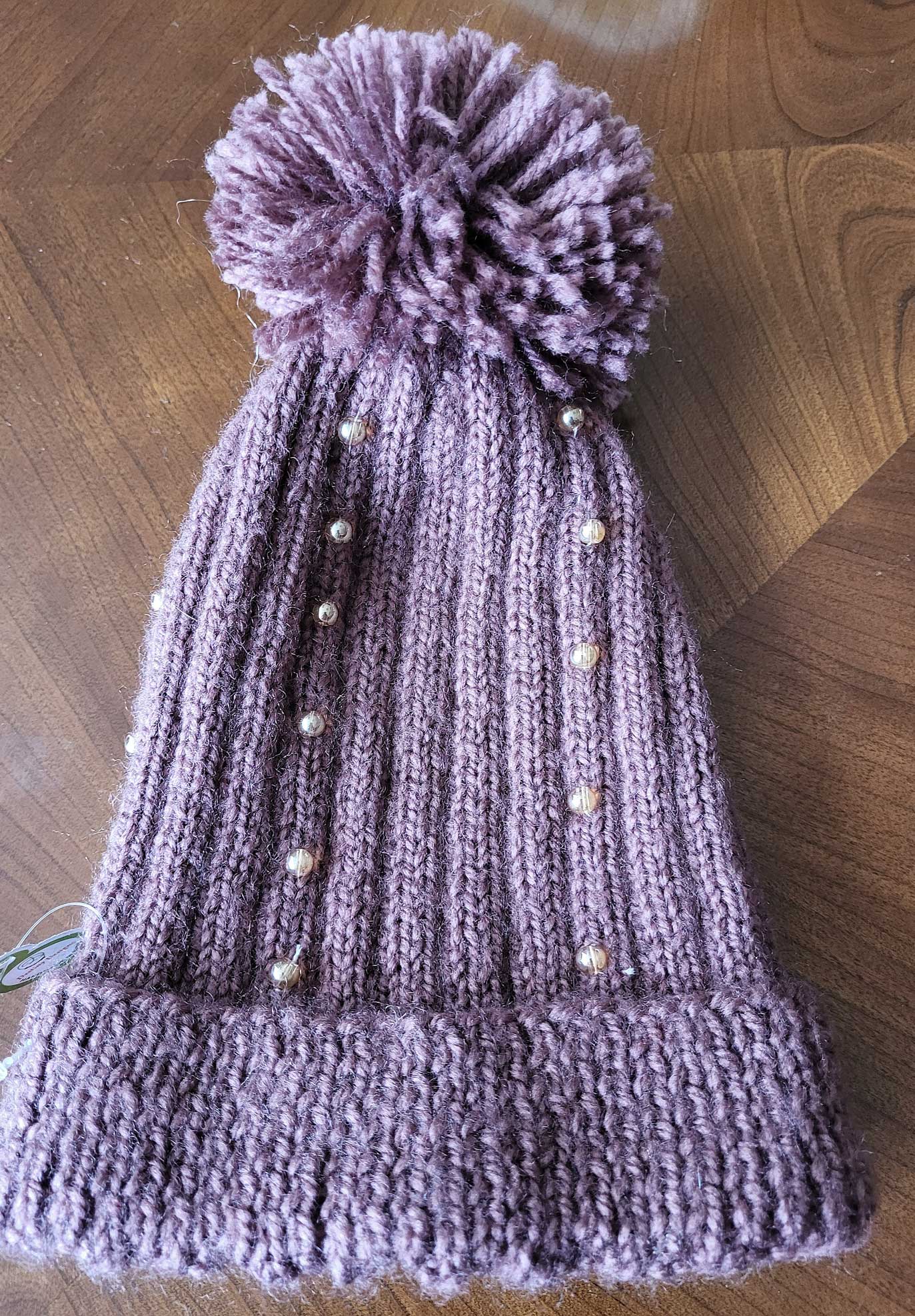 Pom pom embellished hats