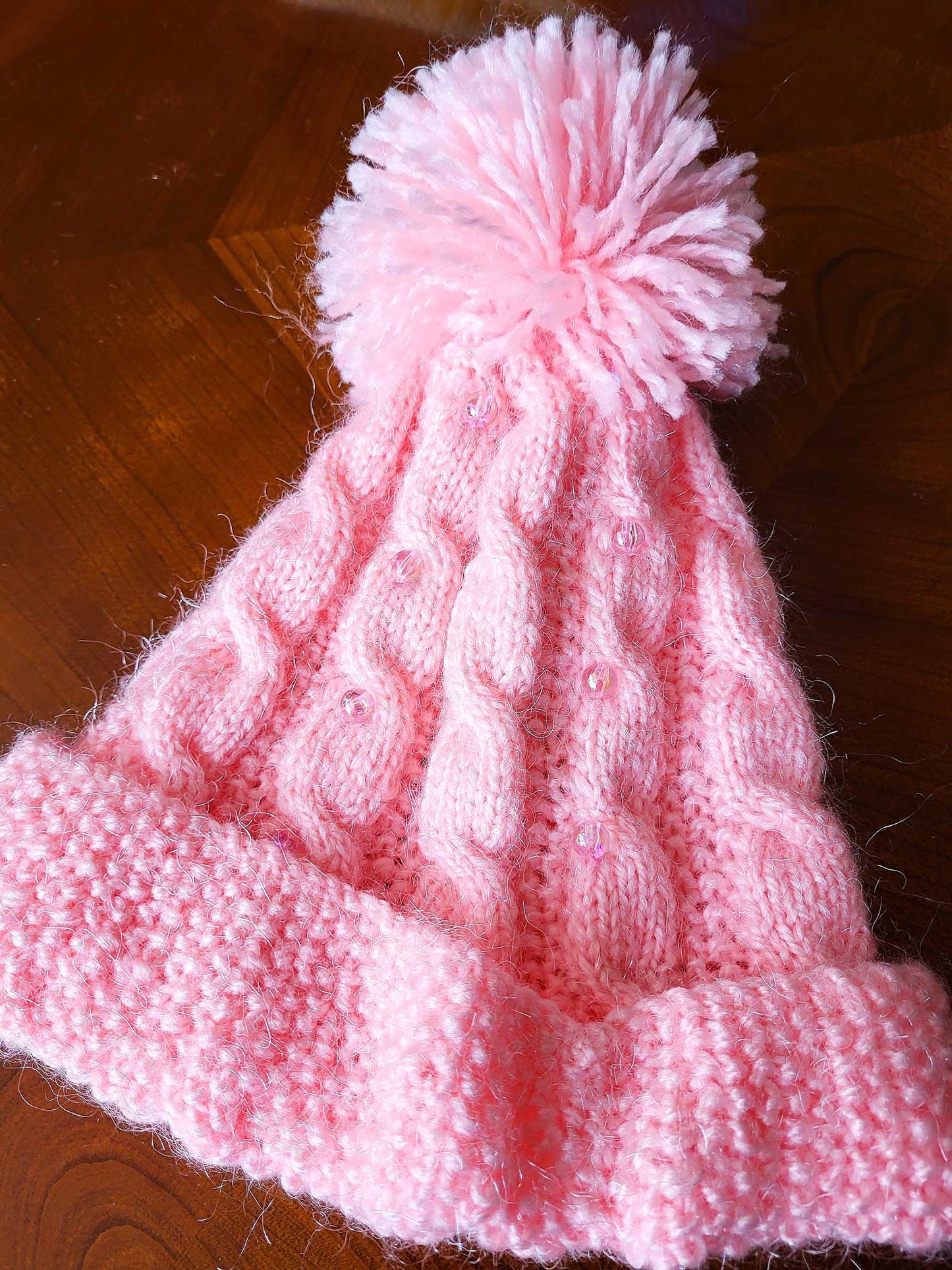 Pom pom embellished hats